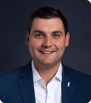 Professional portrait of Andrew Titus, a leader at United Franchise Group, showcasing expertise in franchise development and business growth.