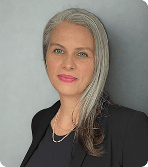 Successful woman in business attire representing United Franchise Group, highlighting franchise opportunities and entrepreneurial growth.